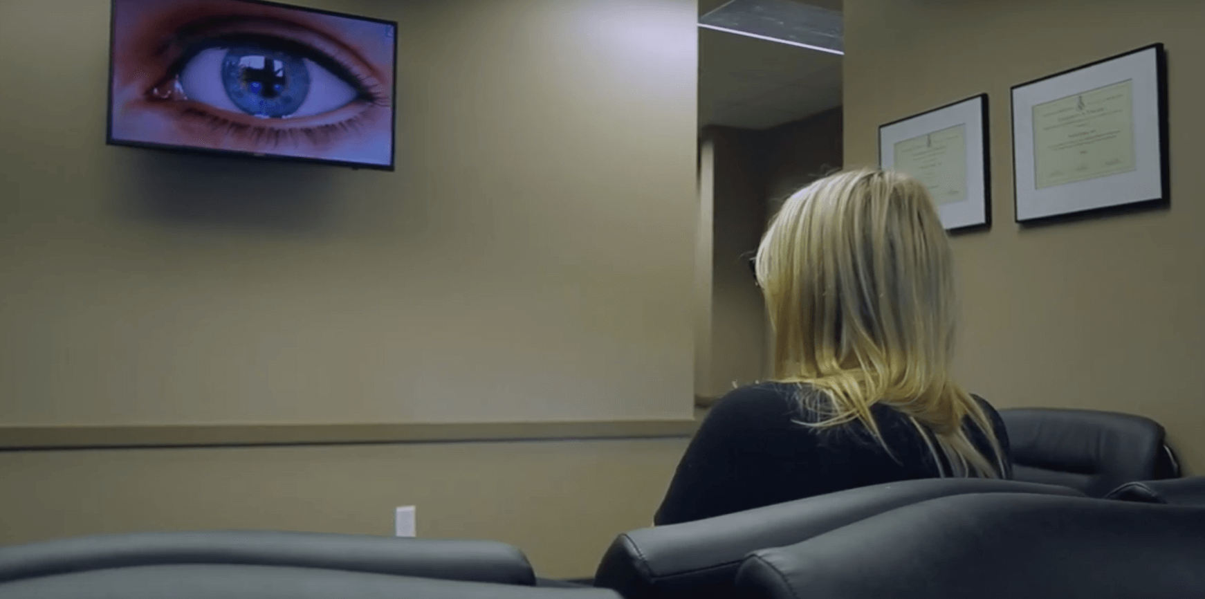 Jessica watching a LASIK video