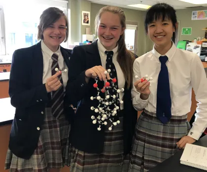 TCS Students Holding Molecule Model