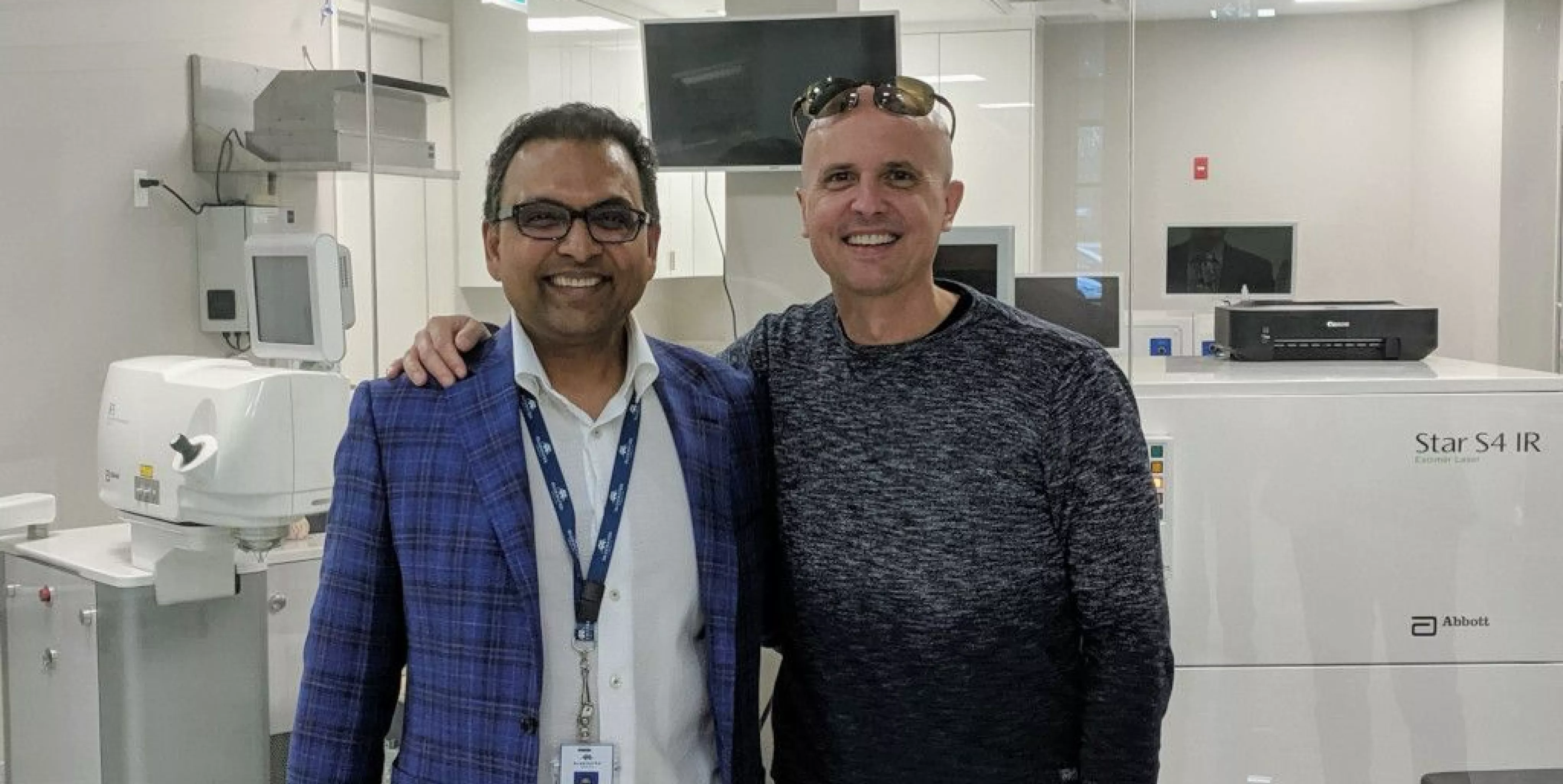 Dr. Lane congratulates Dr. Murari Patodia at the grand opening of "Patodia Eye Institute" in Sarnia, ON.