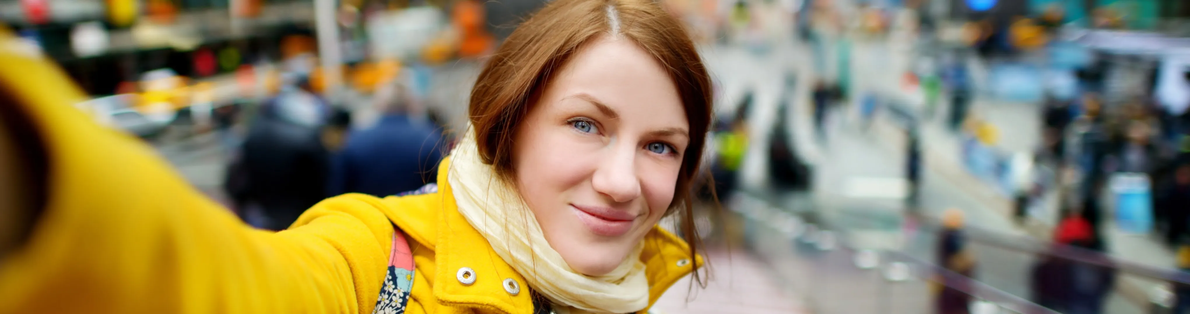 Woman holding camera selfie